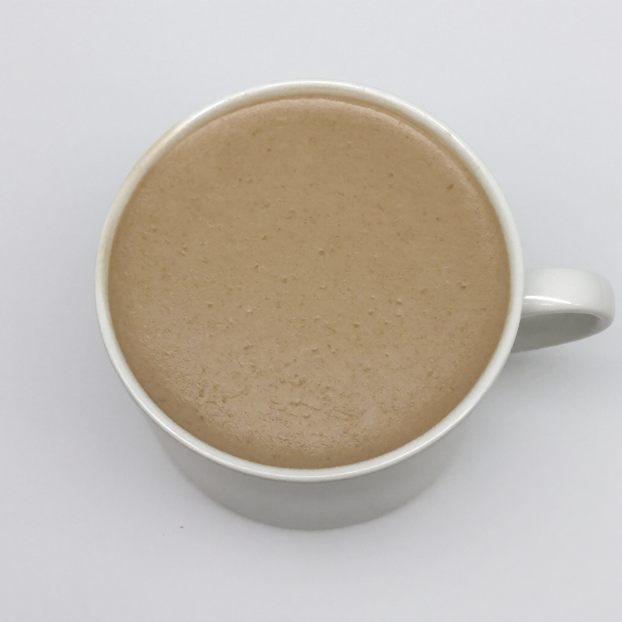 A sterile generic stock photo of a latte on a white studio background